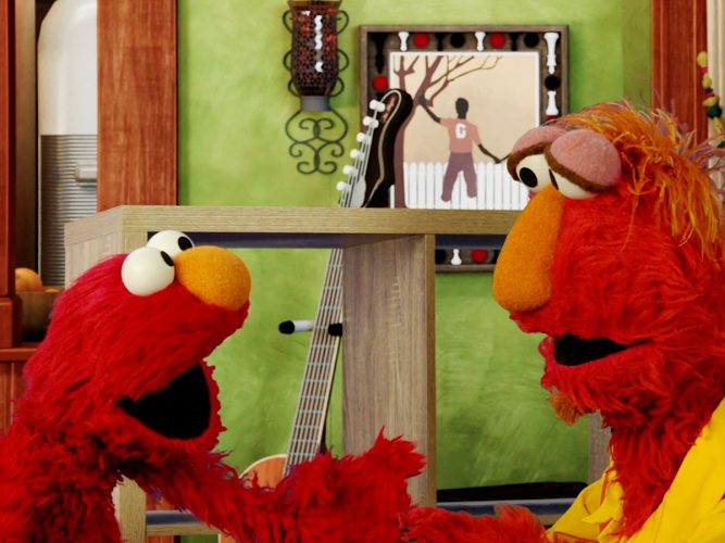 Elmo talking to his dad Louie.